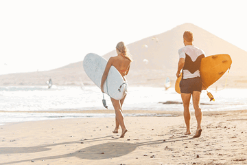 Surfers by the beach